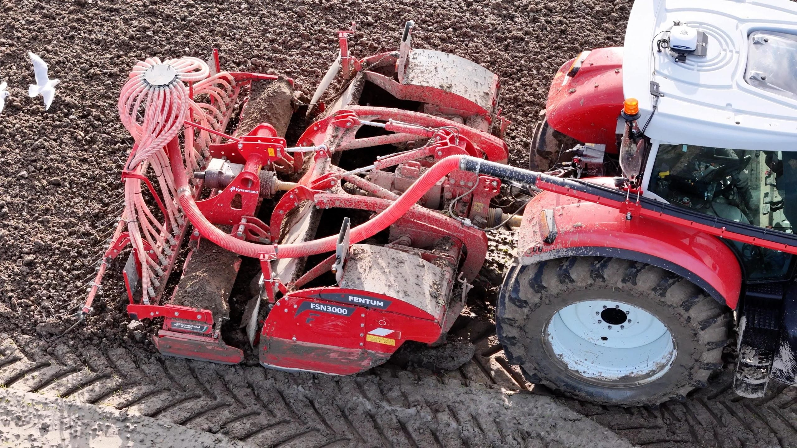 Spitmachine in actie